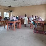 Students participating in a hands-on practical skills training session at Muhokya Parents Secondary School in Kasese.